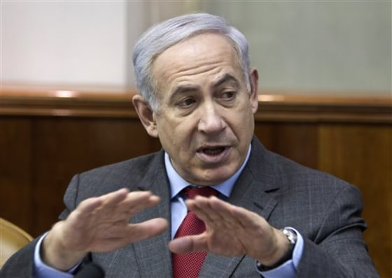 Israeli Prime Minister Benjamin Netanyahu convenes the weekly cabinet meeting in Jerusalem, Sunday, Feb. 26. Netanyahu says Iran's nuclear program will take center stage in his upcoming talks with North American leaders.